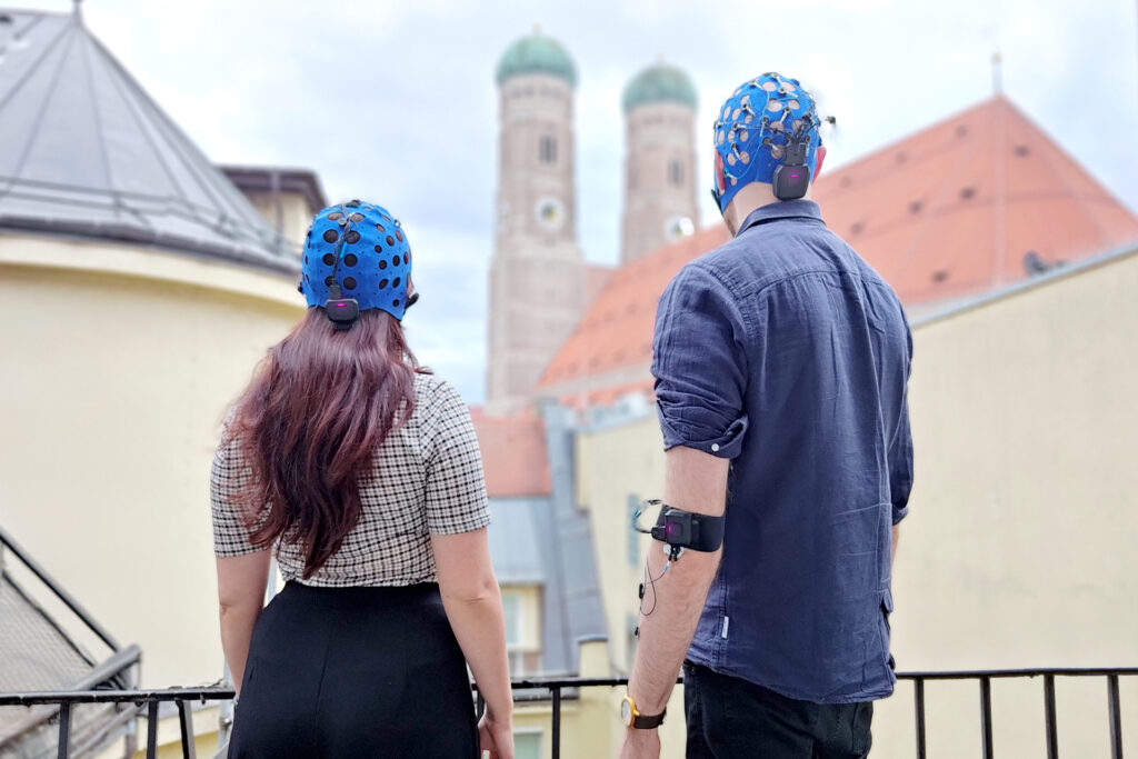 EEG Hyperscanning with two mobile EEG headsets and one mobile EMG amplifier with Frauenkirche, Germany in the background