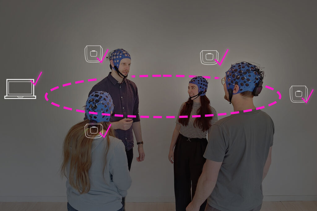 Hyperscanning photo with four EEG caps with dry electrodes and wet electrodes